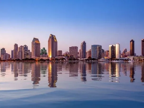 San Diego skyline reflecting on calm water.